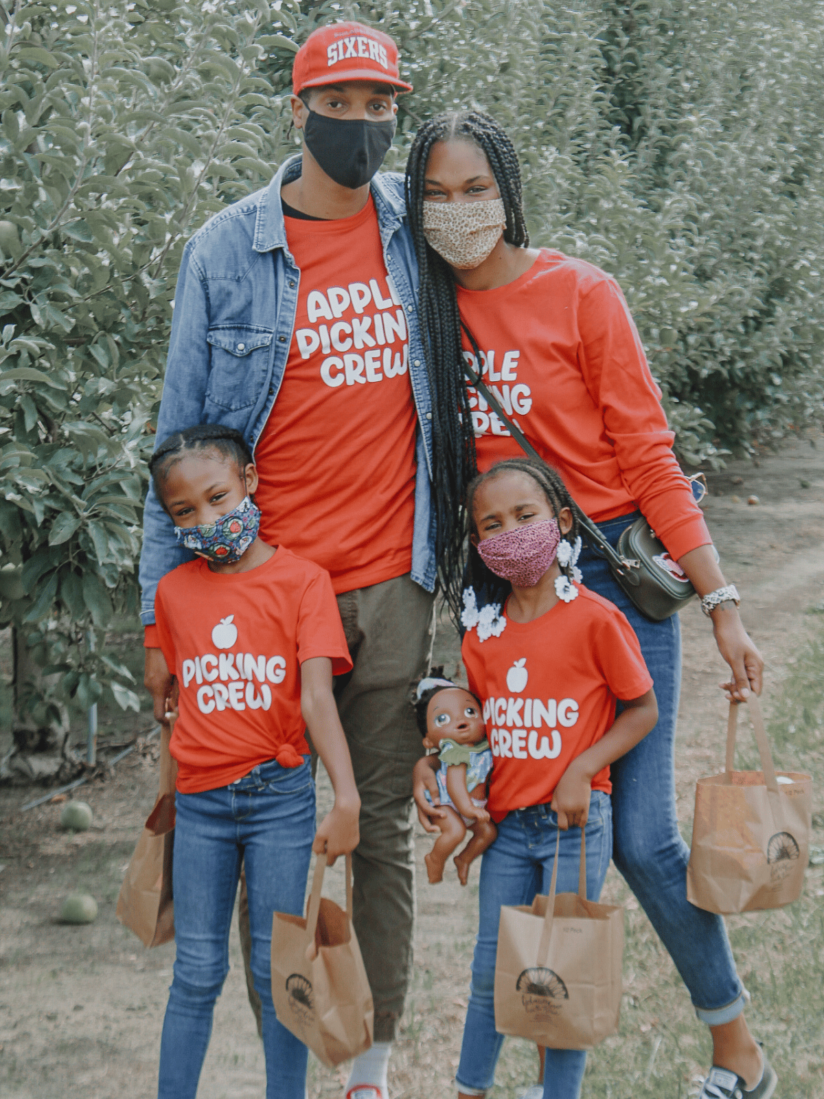 Family in matching Apple Picking Crew Shirts