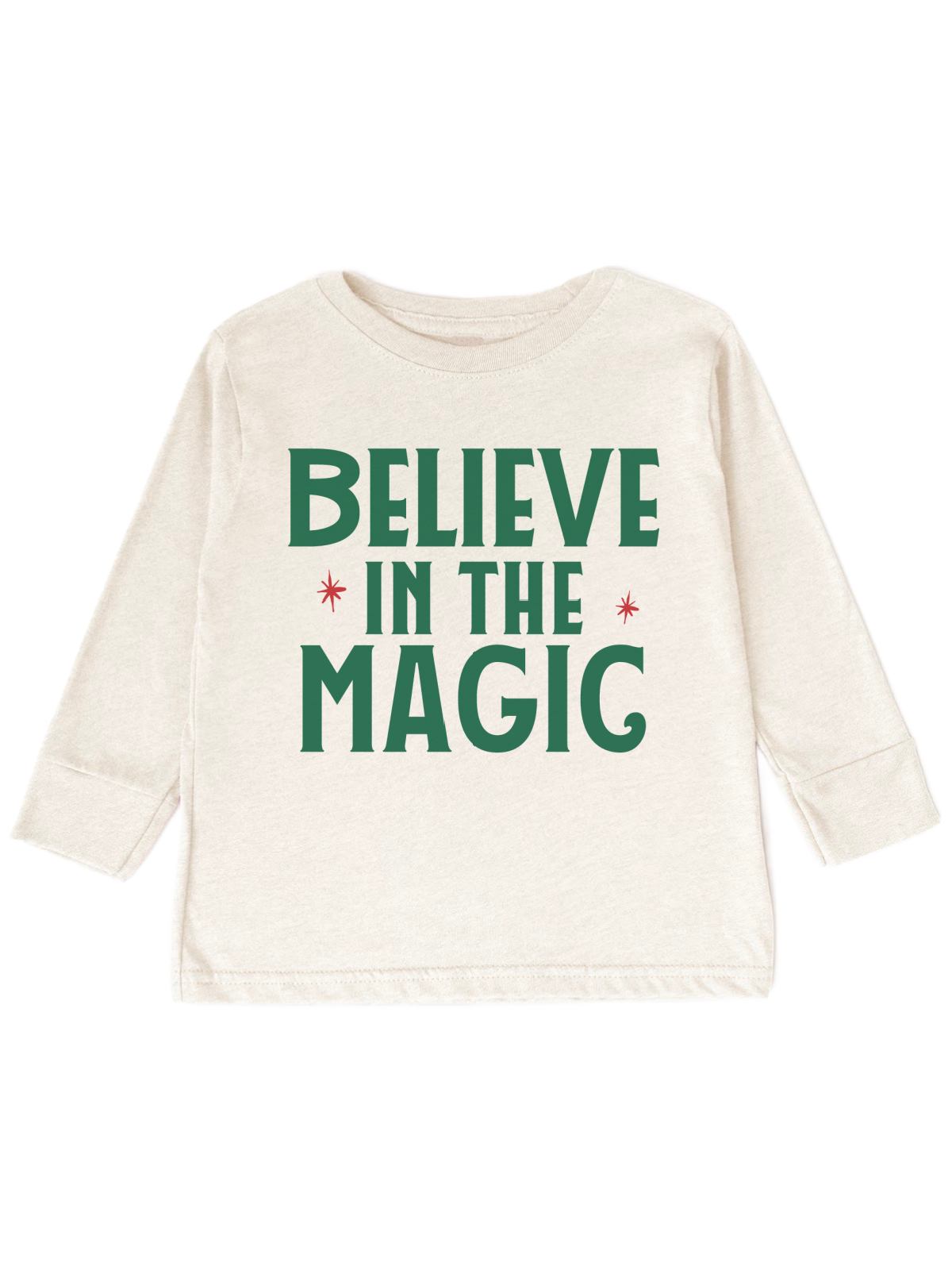 An off-white short-sleeve t-shirt with the phrase 'BELIEVE IN THE MAGIC' printed in dark green block letters, accented with small red starbursts, shown against a plain white background.