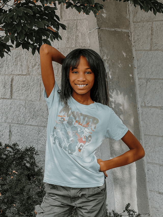 Child wearing Monster Mash Kids Halloween Shirt in Mint – spooky cute monsters graphic tee for fall and trick-or-treat season.
