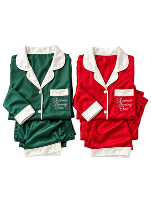 Folded green and white silk pajamas with Christmas Morning Crew pocket detail