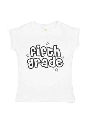A white short-sleeve t-shirt for kids, featuring the words 'fifth grade' in a bold, bubbly black outline font with small heart and star accents, displayed on a solid white background.