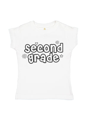 A white short-sleeve t-shirt for kids, featuring the words 'second grade' printed in a playful black outline font with small decorative doodles of flowers, hearts, and stars.