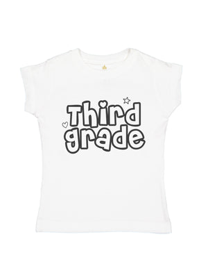 A white short-sleeve t-shirt for kids, featuring the words 'Third grade' printed on the front in a black and white bubbly font with small heart and star accents.