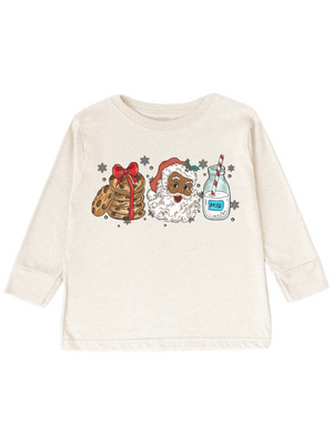 An off-white long-sleeve t-shirt with a colorful graphic print featuring a stack of pancakes with a red bow, a smiling Santa Claus, a bottle of milk labeled 'MILK', and snowflake details.
