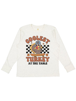 Long sleeve natural kids shirt that reads Coolest turkey at the table