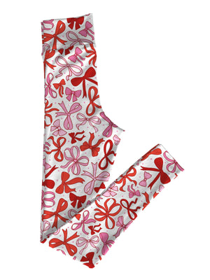 Coquette Bows Women's Valentine's Leggings featuring a custom red and pink bow pattern on a white background, made with soft double-brushed poly fabric and a high-rise waistband.