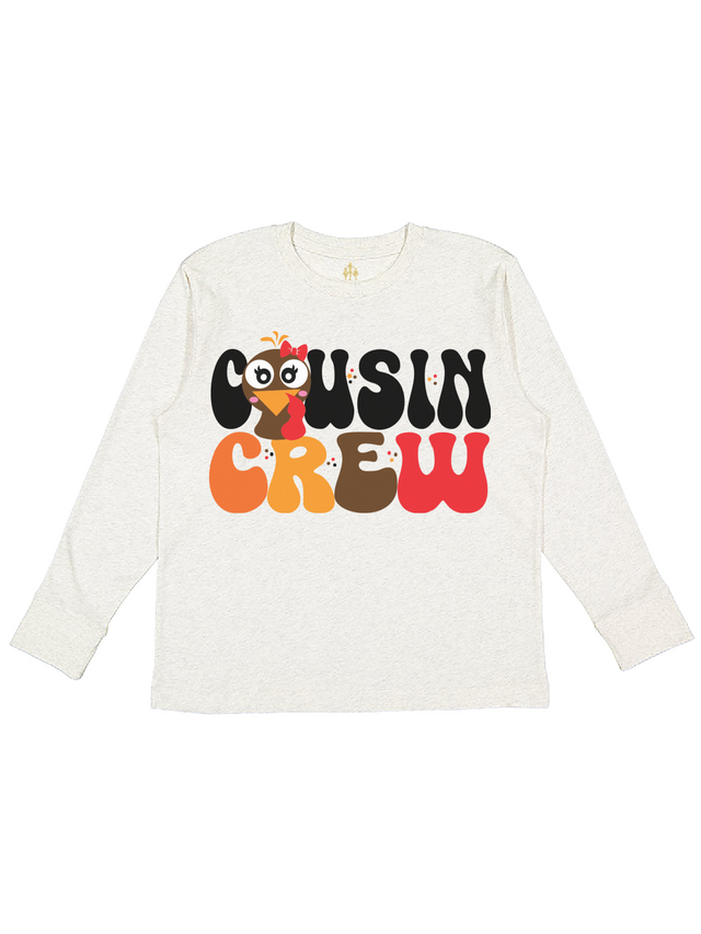 Long sleeve kids natural Thanksgiving shirt that says Cousin Crew with turkey face