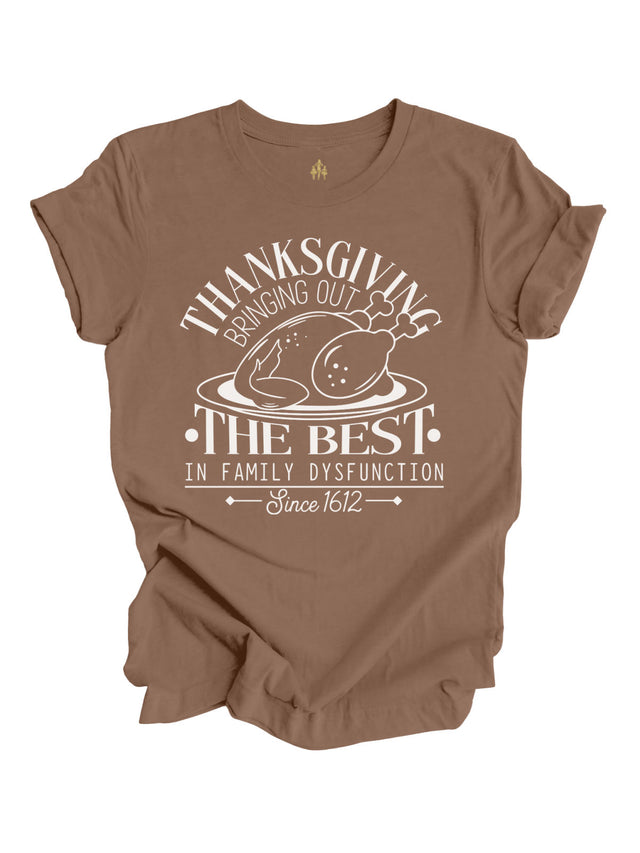 short sleeve brown adult shirt that reads Thanksgiving bringing out the best in family dysfunction since 1612