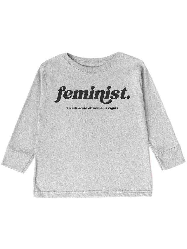 long sleeve heather gray kids shirt that reads Feminist. an advocate of women's rights in retro font