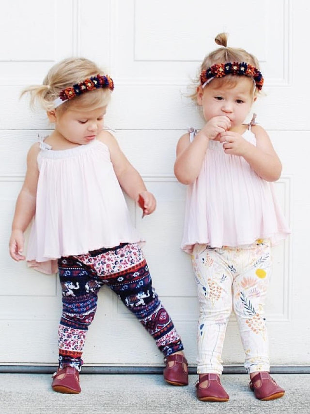 Twin girls in coordinating leggings