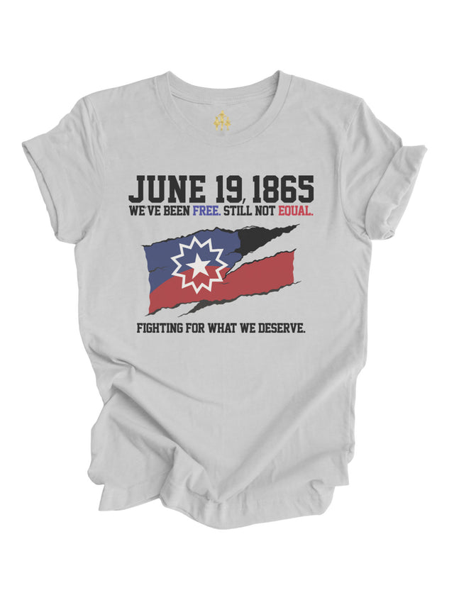Adult Juneteenth t-shirt in athletic gray with 'June 19, 1865 – We've Been Free. Still Not Equal. Fighting for What We Deserve' and a distressed Juneteenth flag graphic by Mackenzie Madison of Philadelphia.