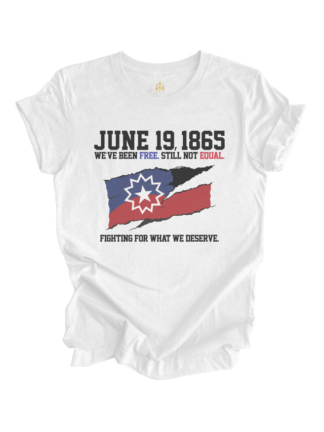 Adult Juneteenth t-shirt in white featuring a torn Juneteenth flag and the message 'June 19, 1865 – We've Been Free. Still Not Equal. Fighting for What We Deserve' by Mackenzie Madison of Philadelphia.