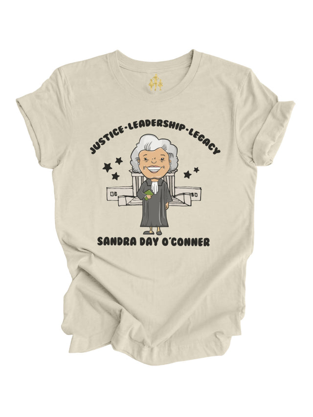 Natural-colored Women’s History Month t-shirt featuring Sandra Day O’Connor illustration, Supreme Court backdrop, and "Justice, Leadership, Legacy" message.