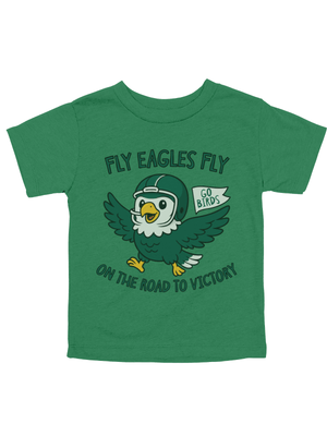 A toddler's short-sleeve green t-shirt featuring a cartoon graphic of an eagle wearing a football helmet, with the text 'FLY EAGLES FLY' above and 'ON THE ROAD TO VICTORY' below.