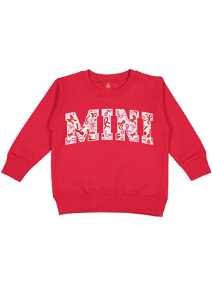 Red girls Valentine’s Day sweatshirt featuring a coquette bows design with "MINI" text in pink and red tones, displayed flat on a white background.