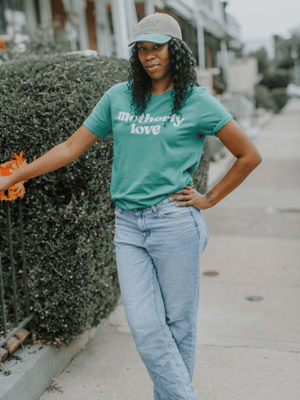 Philly mom wearing Motherly Love graphic tee
