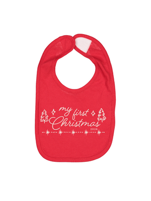 A red baby bib with white printed text reading 'my first Christmas 2023' and small Christmas tree and star illustrations, shown on a plain white background.