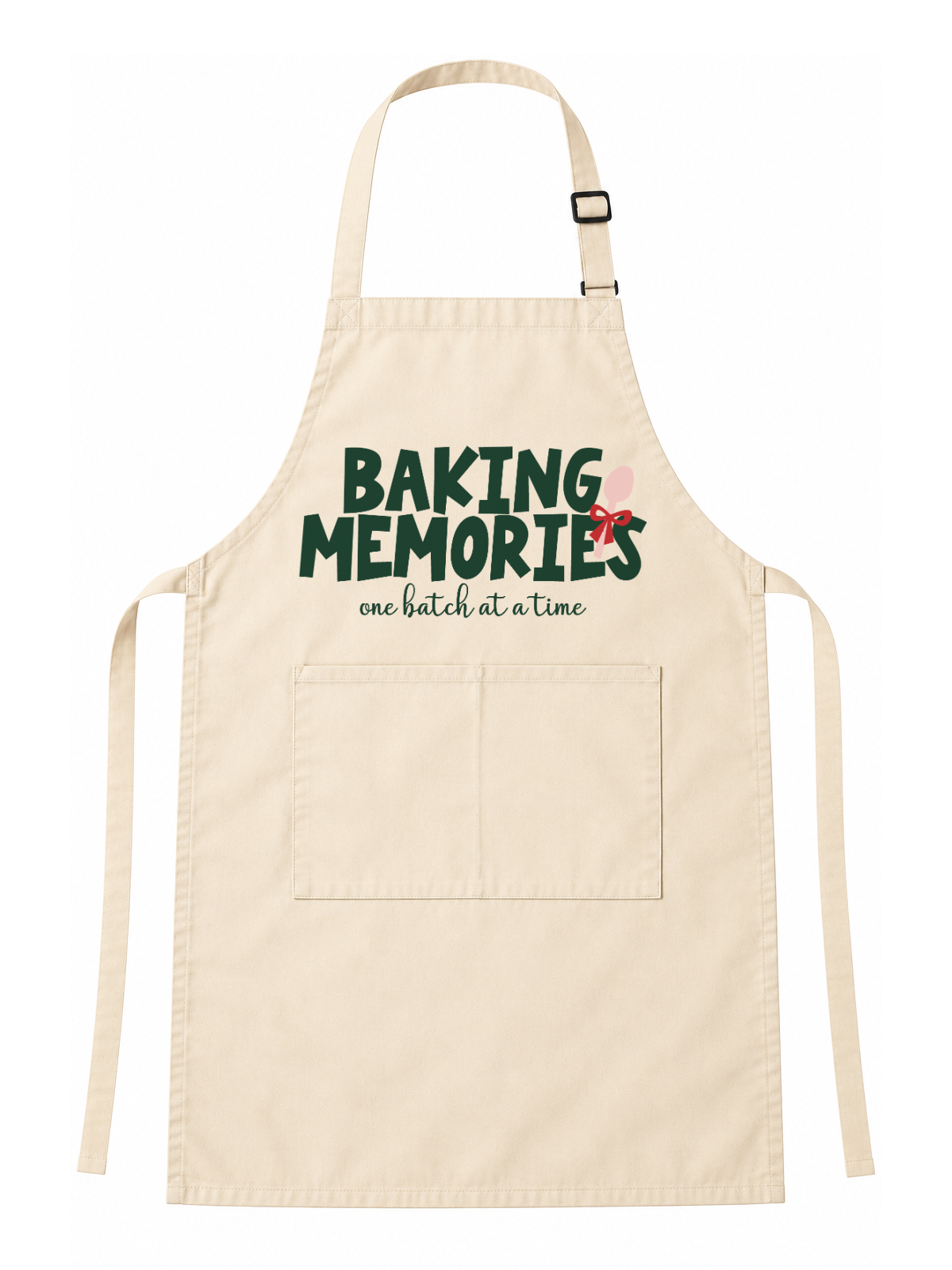 A light beige fabric apron with a front pocket, featuring the printed text 'BAKING MEMORIES one batch at a time' in dark green and pink on the chest, displayed against a solid white background.