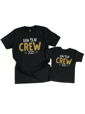 Matching black short sleeve t shirts that read New Year Crew 2025