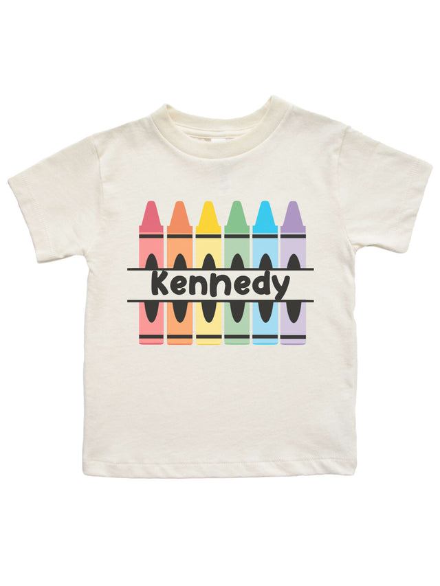 Natural color kids shirt with pastel crayon design and personalized name “Kennedy”