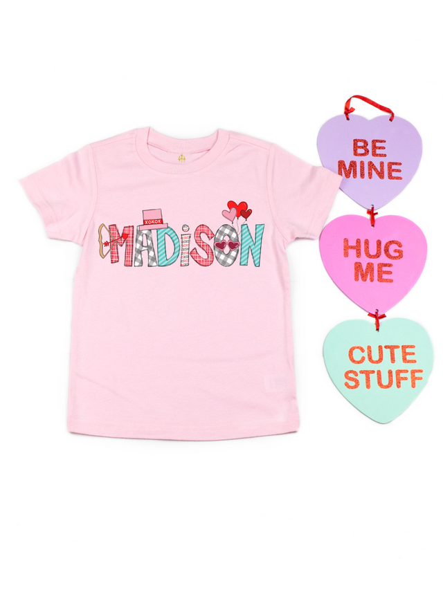 Personalized pink Valentine's Day shirt that reads Madison with candy hearts sign that says Be Mine, Hug Me, Cute Stuff