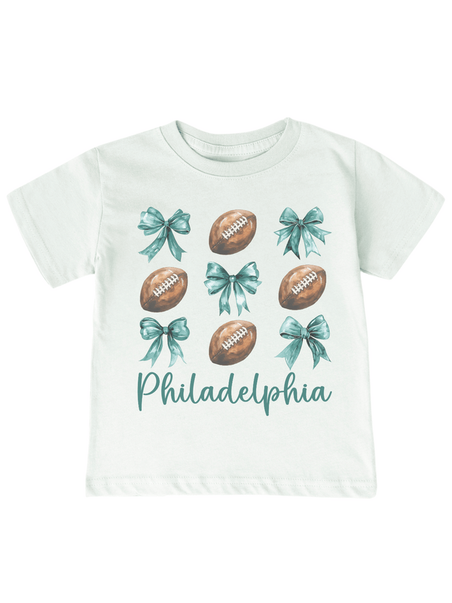 Philadelphia football coquette bows kids tee in melon green