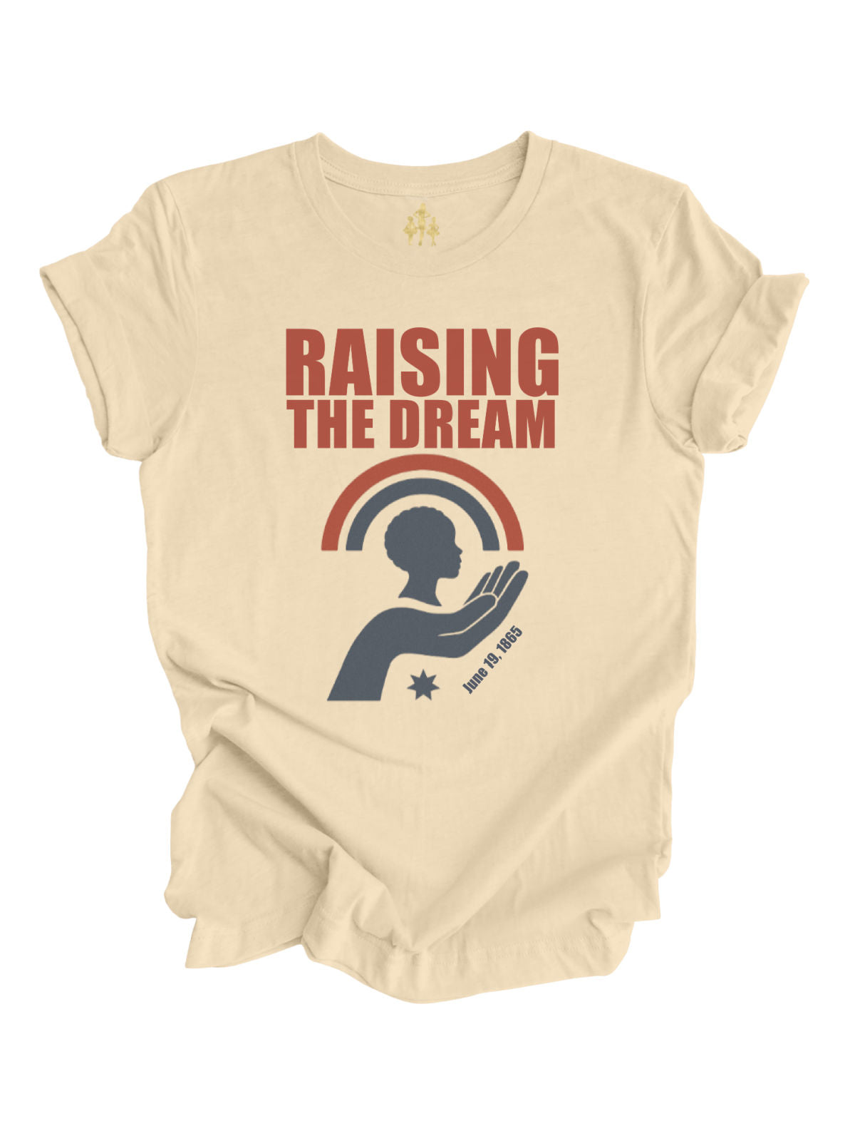 Natural cream adult Juneteenth shirt with the phrase “Raising the Dream” above a silhouette of a child held in an open hand under a red and navy rainbow with the date June 19, 1865.