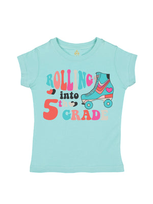 Light blue girls’ t-shirt with colorful “Rolling into 5th Grade” text and a retro roller skate graphic with hearts