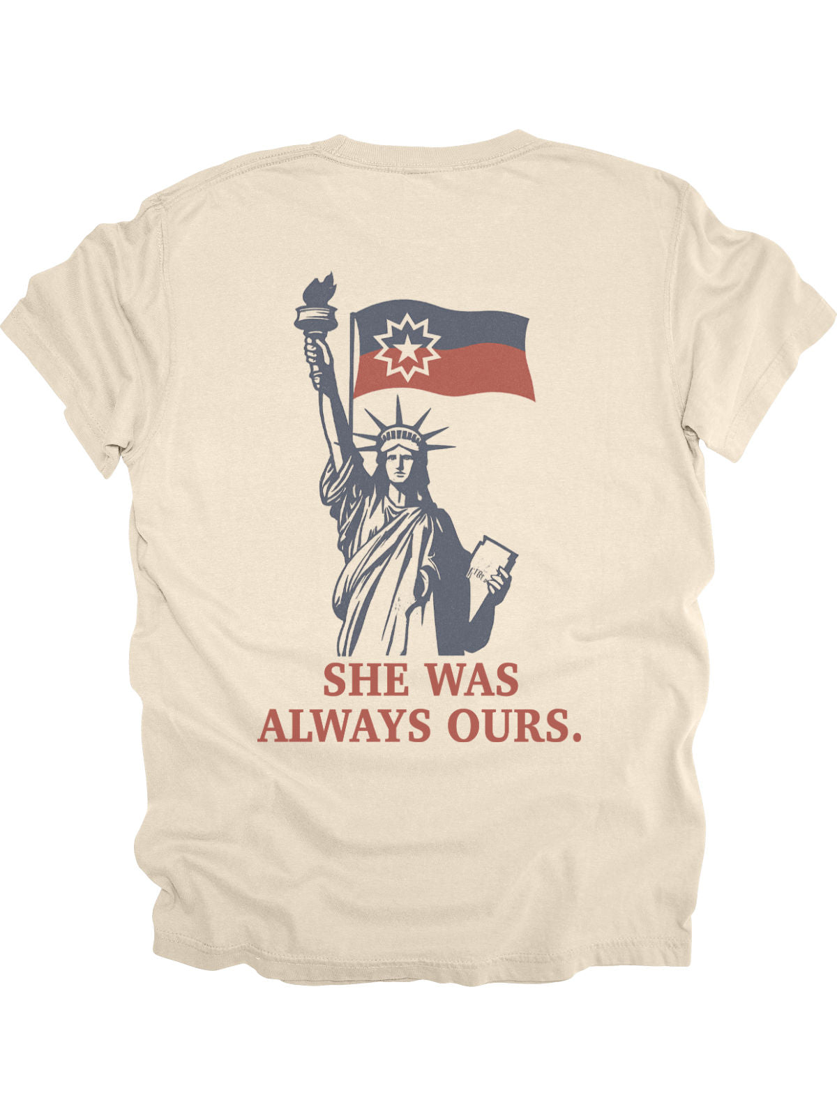Lady Liberty Juneteenth adult shirt in cream with front pocket-style flag graphic and back design reading “She Was Always Ours.”