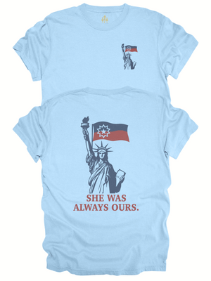 Front and back view of She Was Always Ours Lady Liberty Juneteenth shirt in light blue