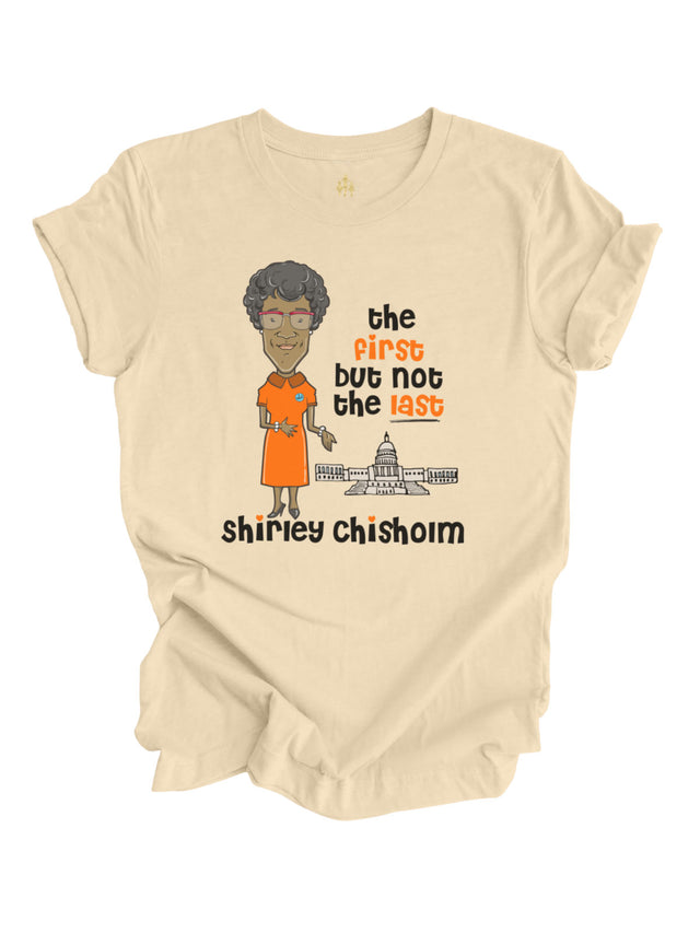 Natural cream-colored Women's History Month t-shirt featuring Shirley Chisholm illustration, U.S. Capitol, and "The First But Not The Last" message.