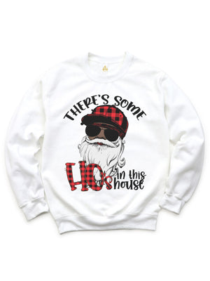 White long sleeve adult Christmas sweatshirt that reads There's Some Ho's in this House with a Black Santa