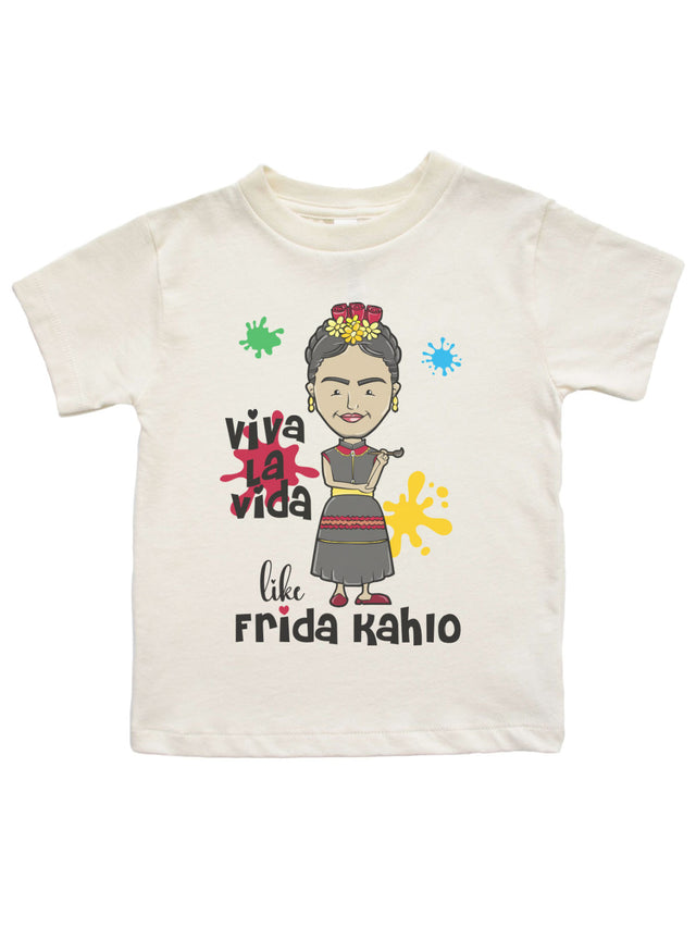 Natural-colored kids’ Frida Kahlo t-shirt featuring a cartoon illustration of the iconic artist with "Viva La Vida Like Frida Kahlo" text and colorful paint splashes.