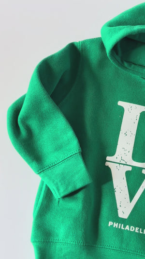 Close up of kids Hoodie in Kelly green with LOVE Philadelphia football design 