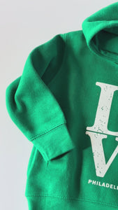Close up of kids Hoodie in Kelly green with LOVE Philadelphia football design 