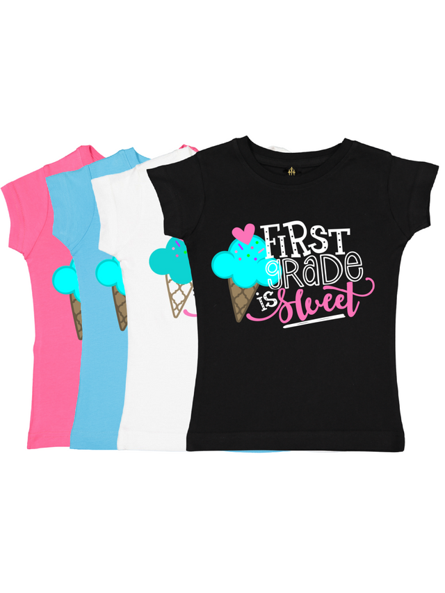 Set of girls' “First Grade is Sweet” t-shirts with colorful ice cream design in black, white, blue, and pink