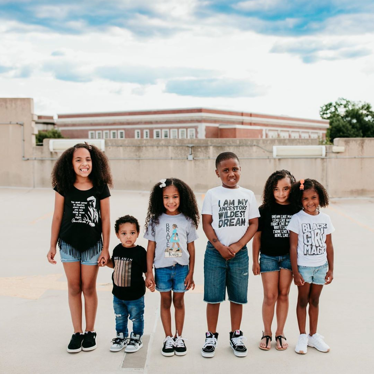 White long sleeve kids shirt that reads Black Girl Magic in retro font