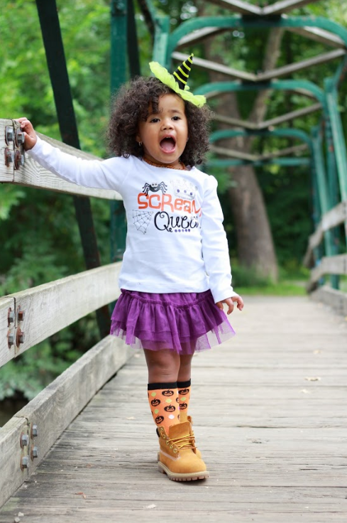 Toddler girl wearing Halloween shirt that says Scream Queen