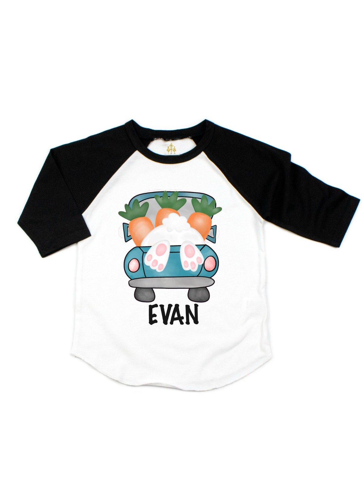 Boys personalized Easter raglan shirt with a bunny and carrot-filled truck design and the name “Evan” on the front.
