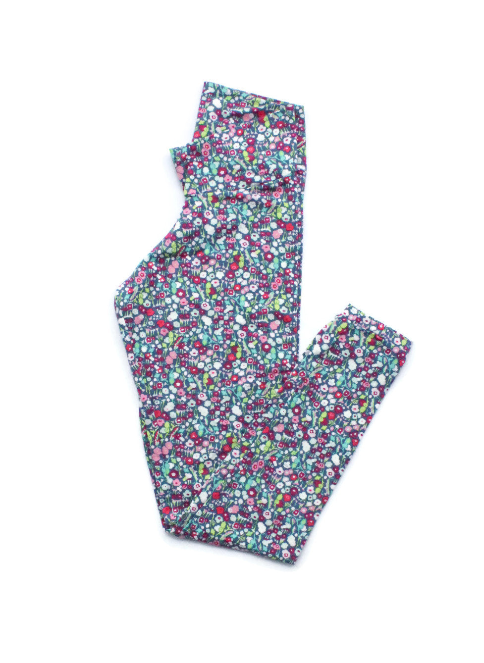 Flat lay of handmade adult leggings with colorful floral print from the Mommy and Me collection