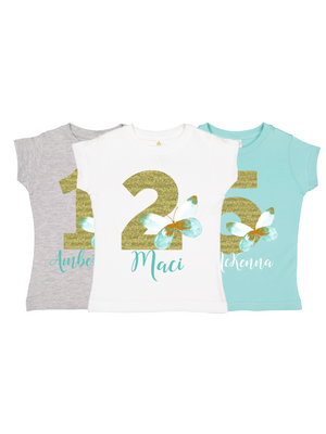 white, blue, and gray girls green butterfly shirt