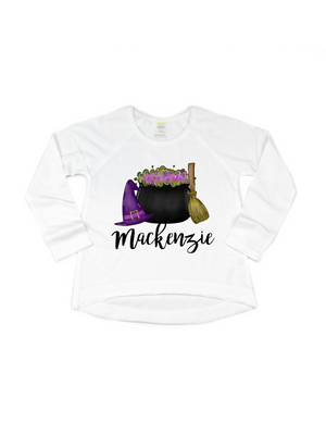 Long sleeve white kids Halloween shirt featuring witch hat, cauldron, and broom