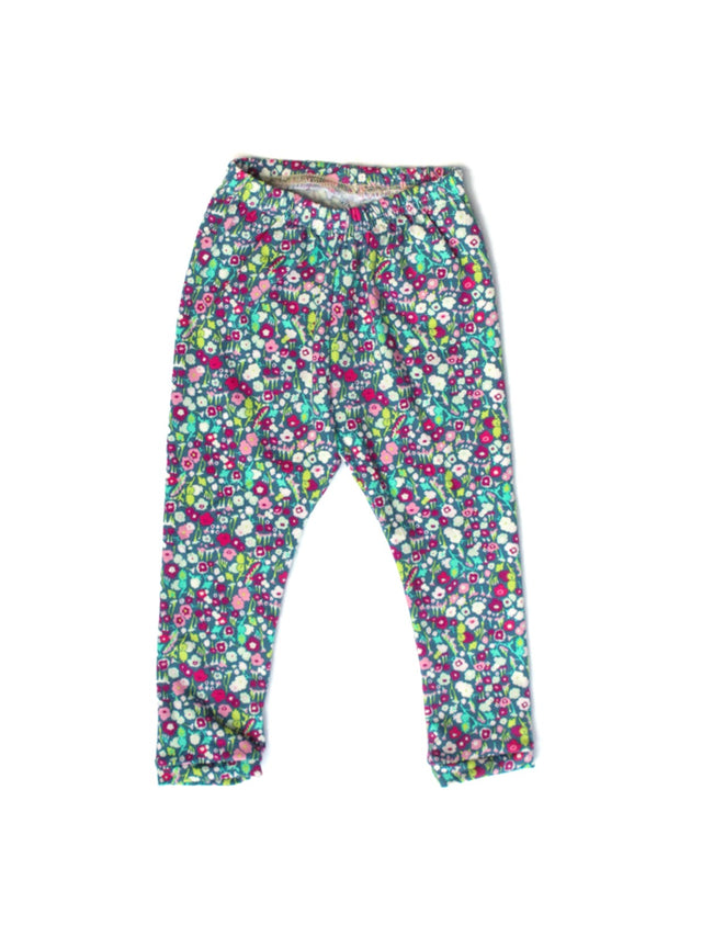 Flat lay of handmade kids floral leggings with elastic waistband from the Mommy and Me collection