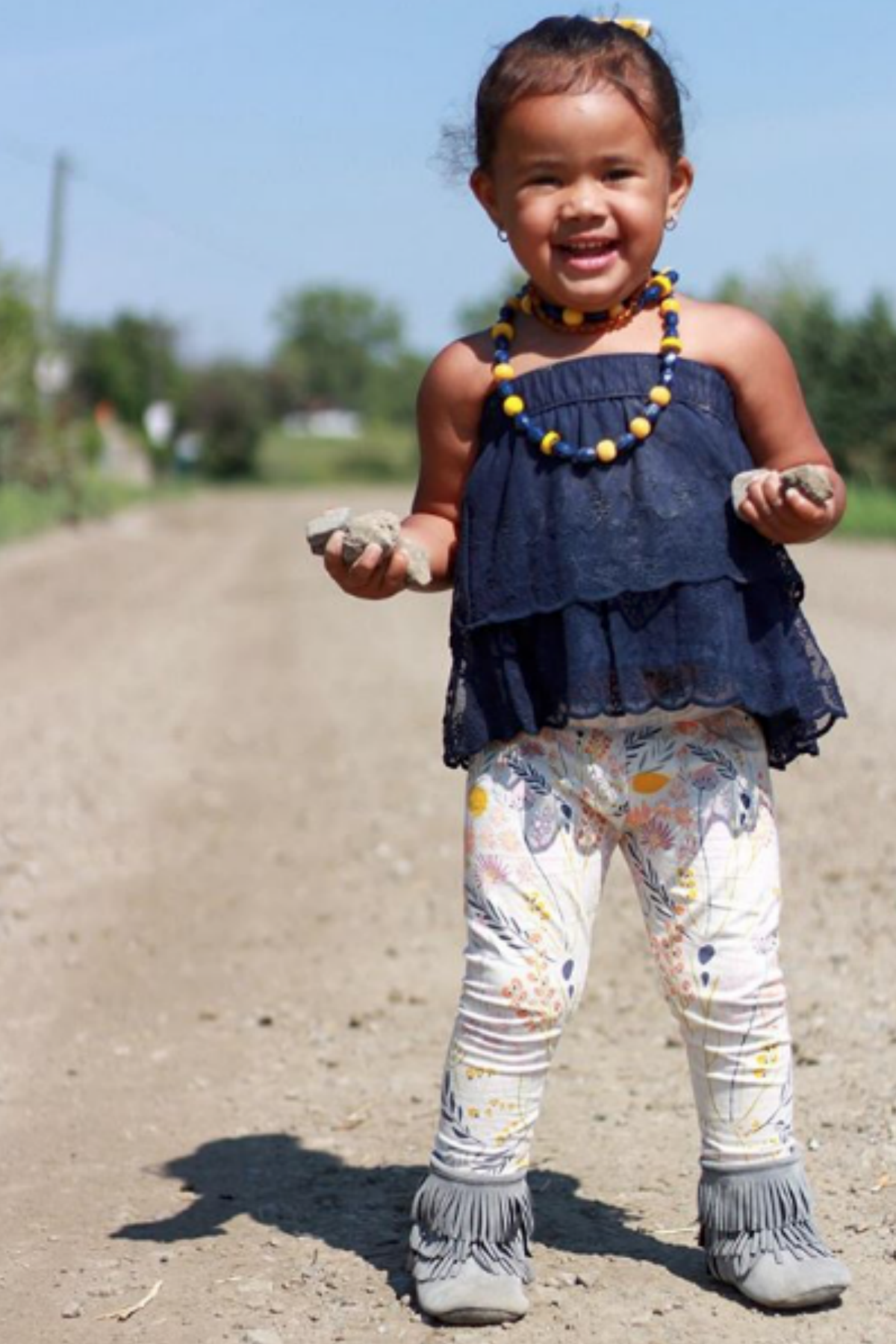 Kids floral leggings with whimsical wildflowers and leaves in peach, mustard, lavender, and navy on a cream background